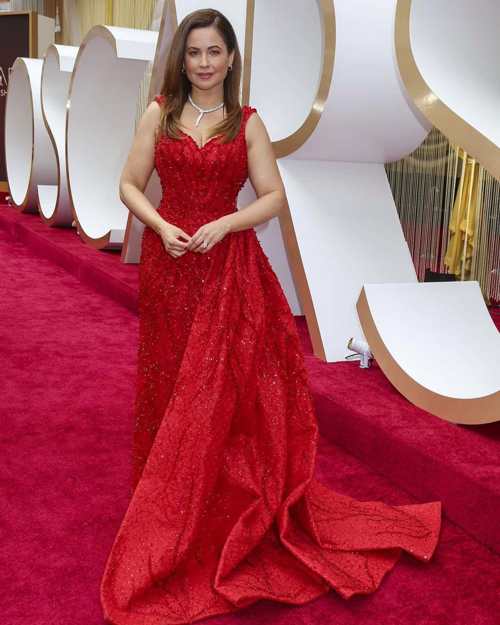 In Naja Saade Red Gown on the Red Carpet of The Oscars 2020
